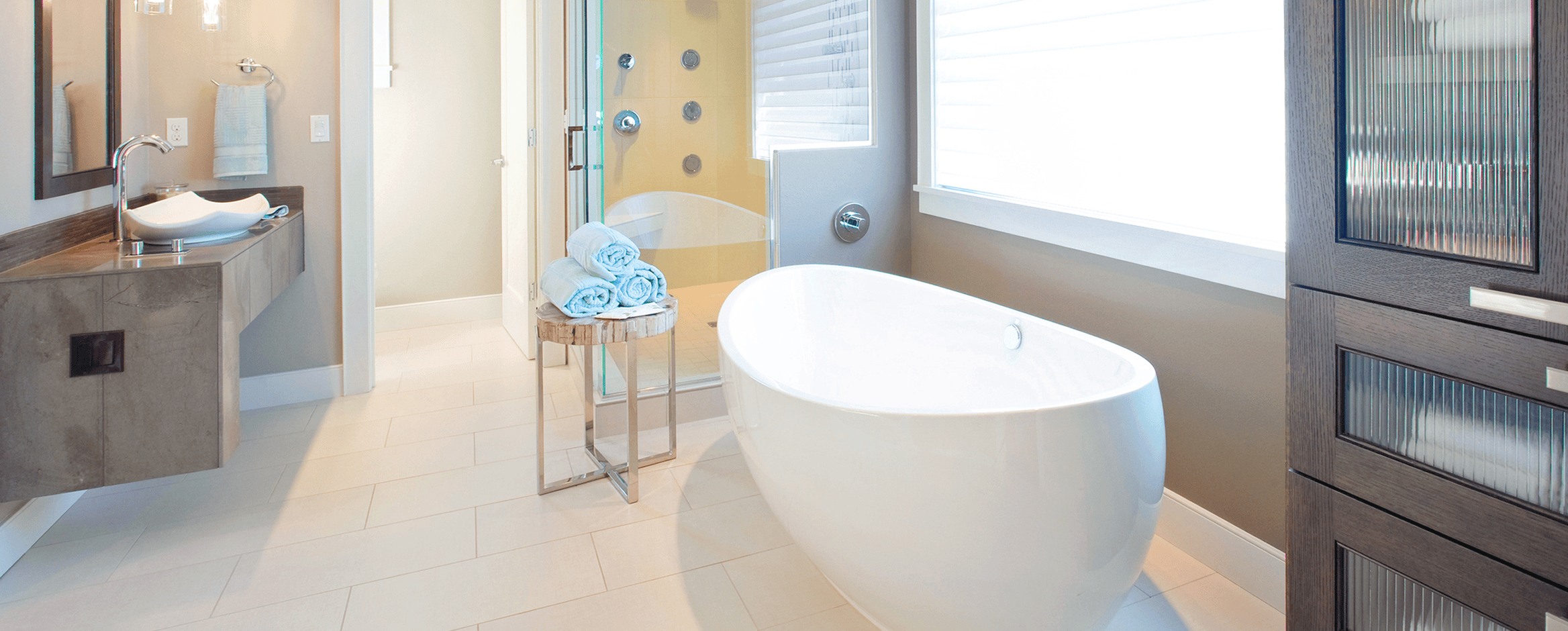 Modern bathroom with freestanding bathtub and shower.